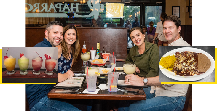 A group of people sitting at a table with drinks.