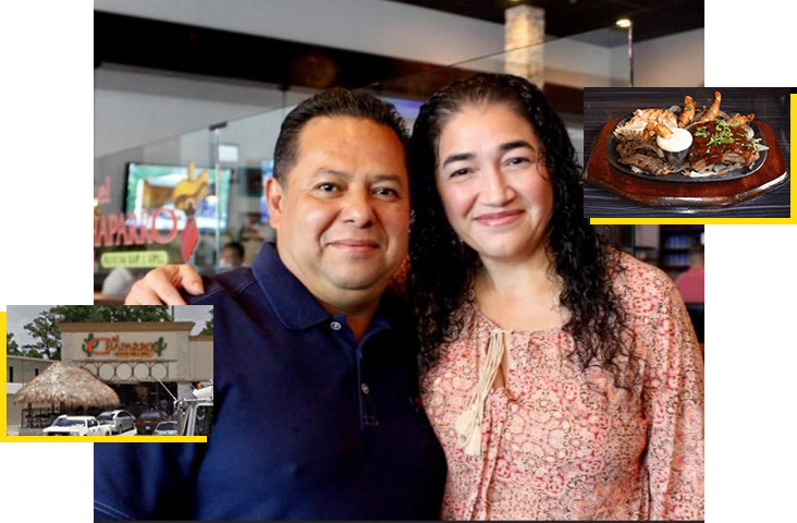 A man and woman posing for the camera.